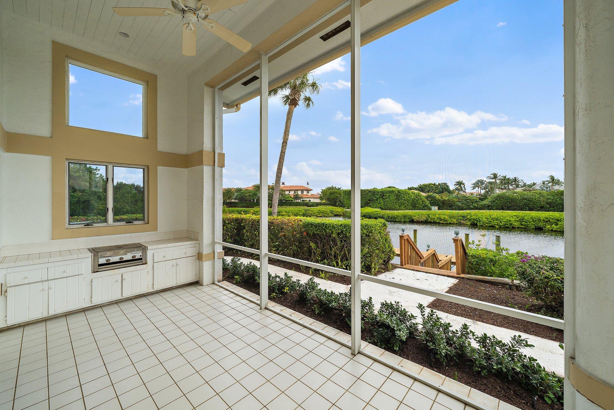3388 Barrow Island Road Jupiter, FL 33477 - Photo 26 of 59 Summer kitchen just outside family room