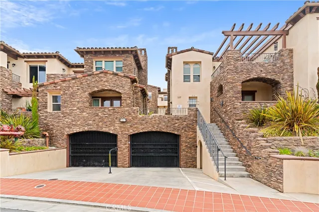 a front view of a house with glass windows