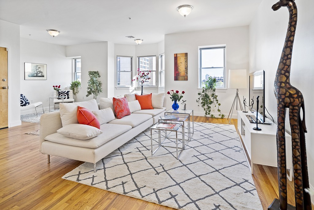 a living room with furniture and a table