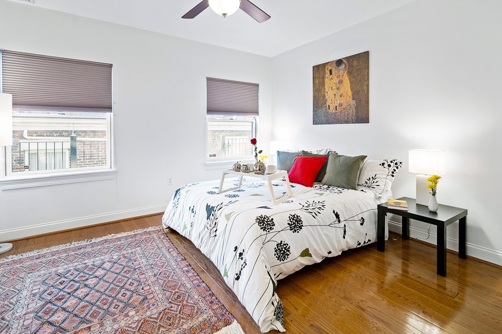 877 Harrison Avenue, Unit 7 Boston, MA 02118 - Photo 20 of 25 a bedroom with a bed wall painting and a window