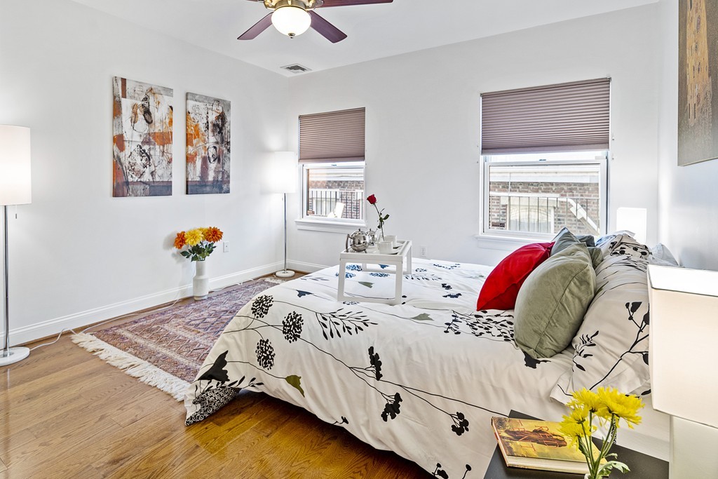 877 Harrison Avenue, Unit 7 Boston, MA 02118 - Photo 21 of 25 a bedroom with bed and a window