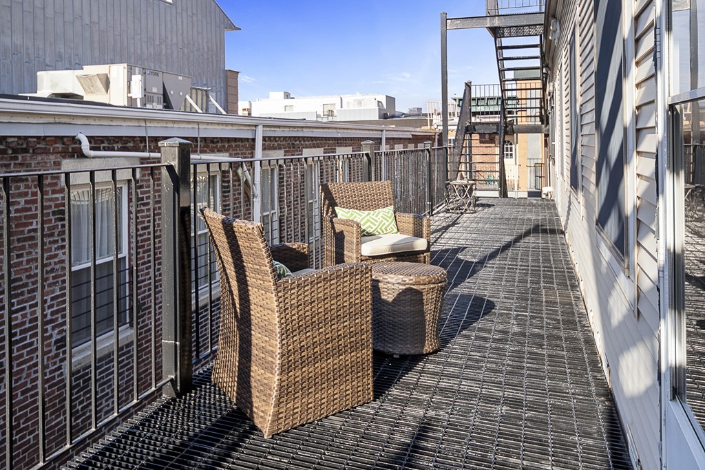 877 Harrison Avenue, Unit 7 Boston, MA 02118 - Photo 22 of 25 a view of a balcony with wooden floor
