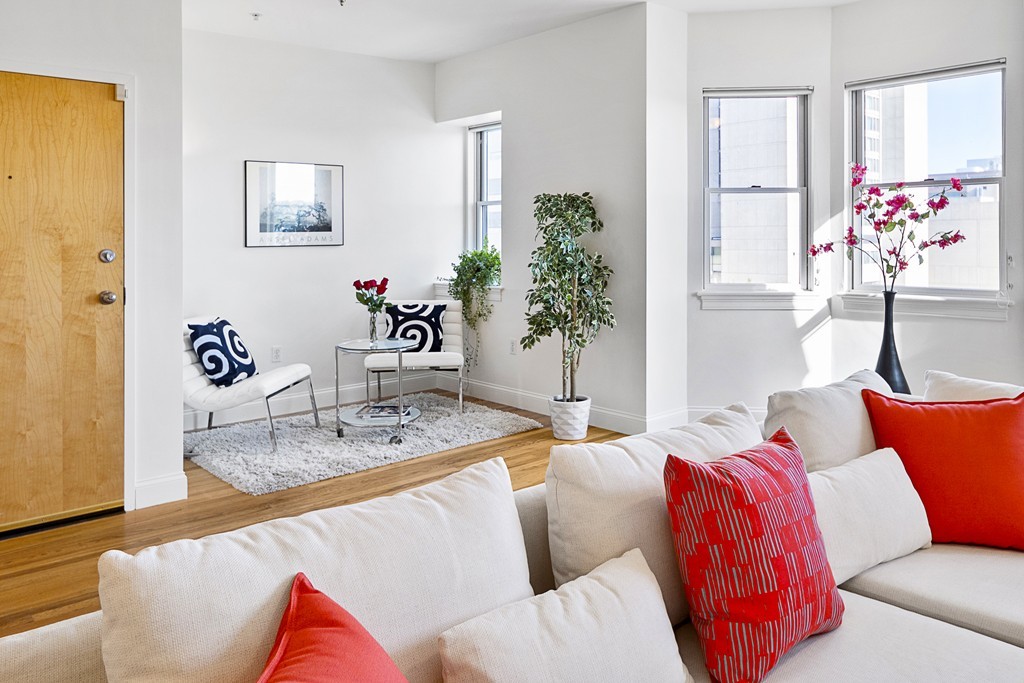 877 Harrison Avenue, Unit 7 Boston, MA 02118 - Photo 6 of 25 a living room with furniture and flowers