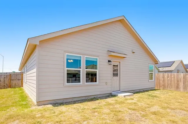 a view of house with yard