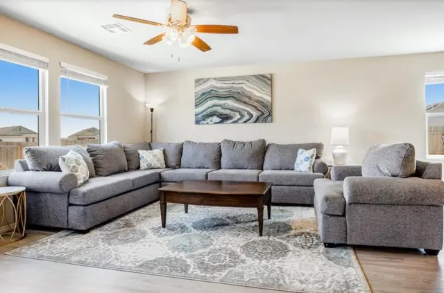 a living room with furniture and a couch