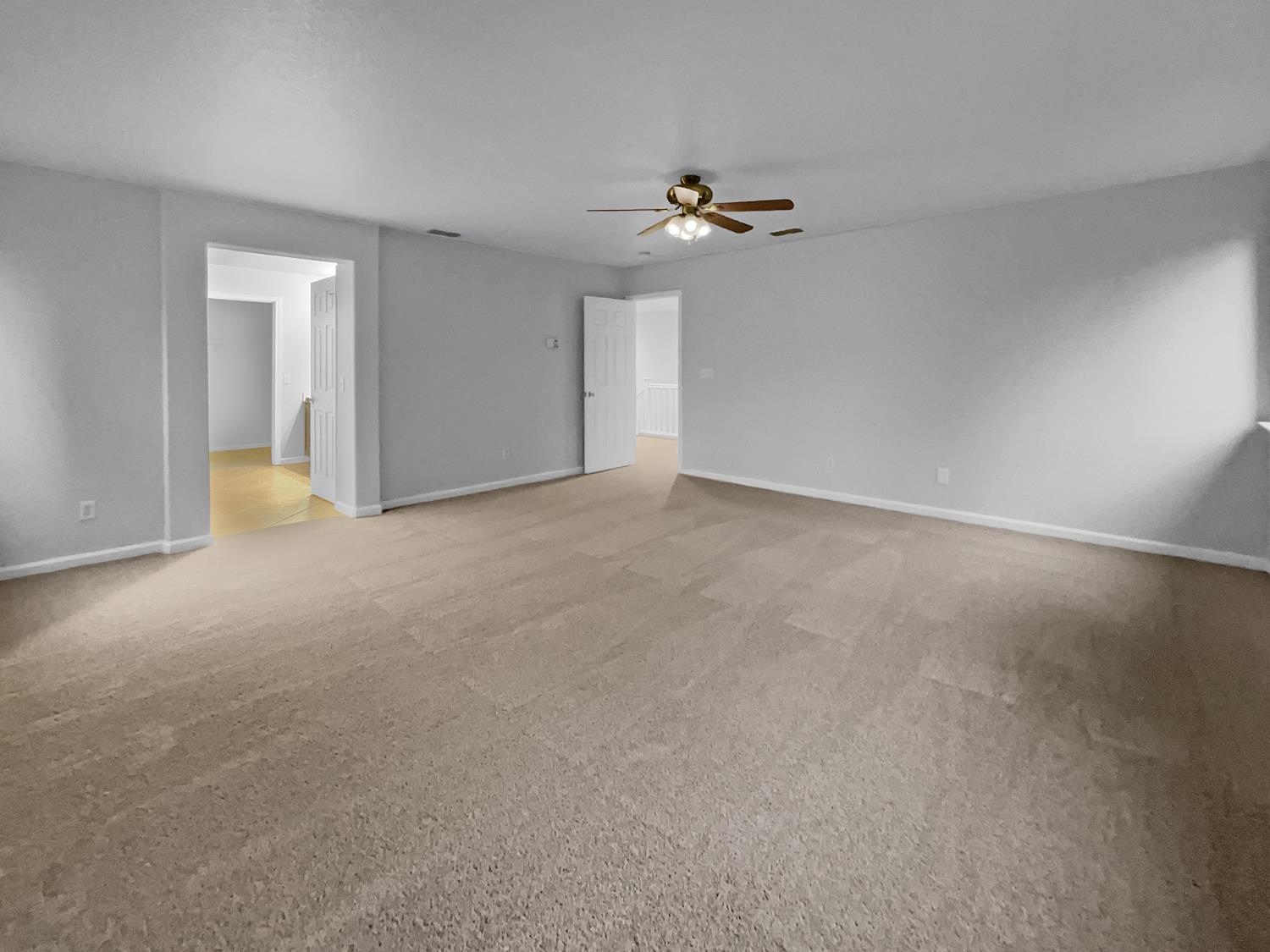 6130 Preston Circle Rocklin, CA 95765 - Photo 12 of 24 a view of an empty room with a chandelier fan