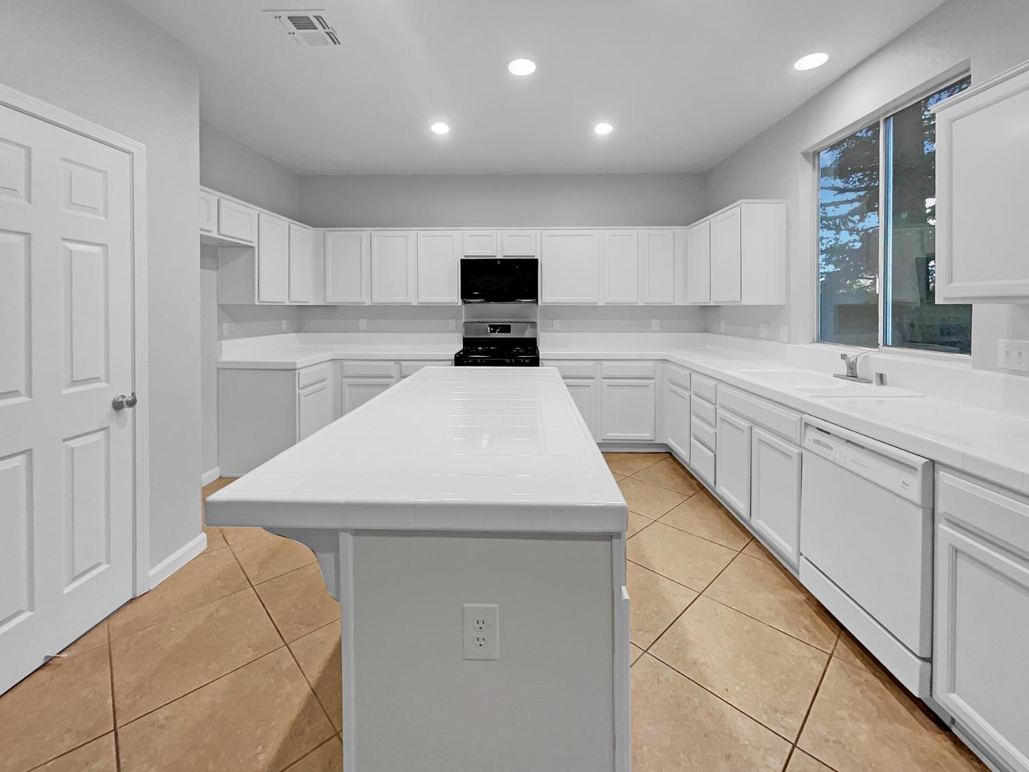 6130 Preston Circle Rocklin, CA 95765 - Photo 5 of 24 a kitchen with a sink and cabinets