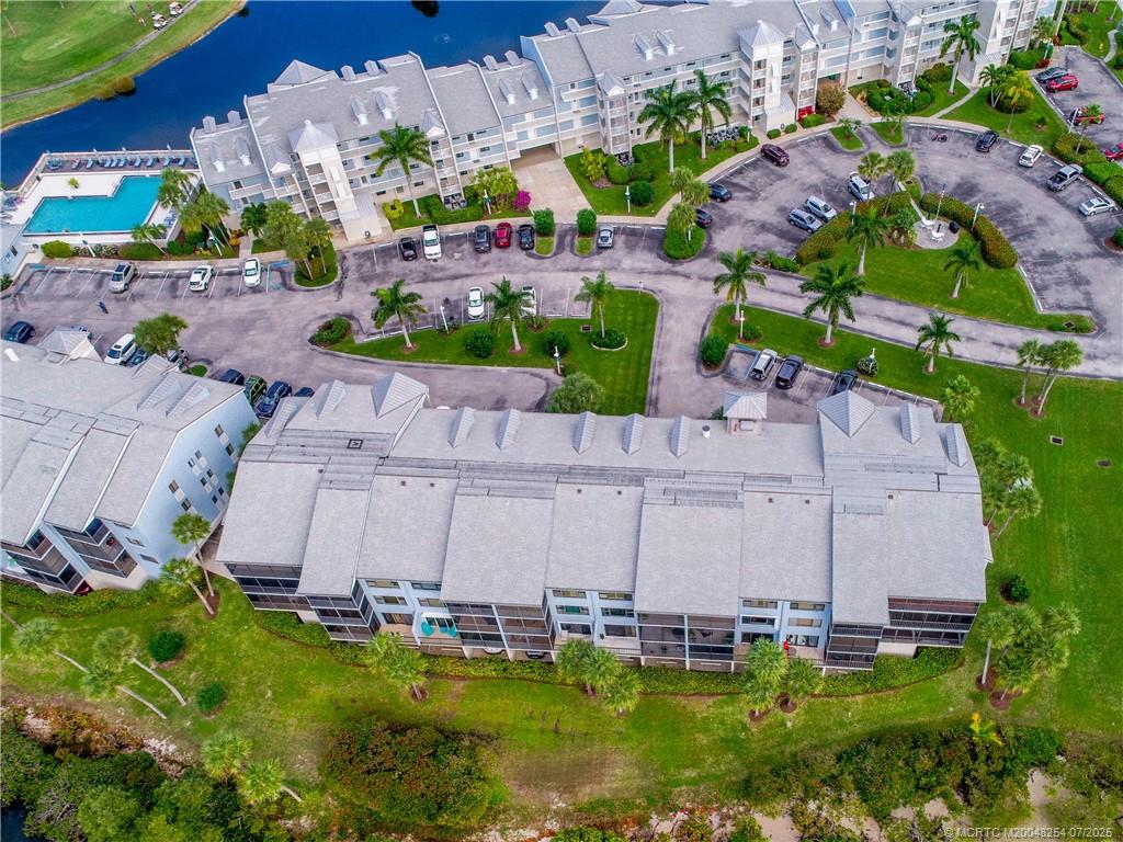 20 Northeast Plantation Road, Unit 307 Stuart, FL 34996 - Photo 2 of 52 an aerial view of a house with a garden and swimming pool