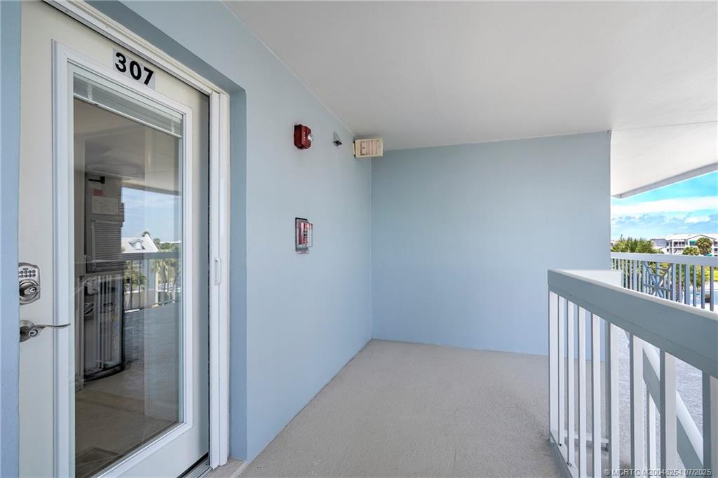 20 Northeast Plantation Road, Unit 307 Stuart, FL 34996 - Photo 3 of 52 a view of a hallway with a elevator