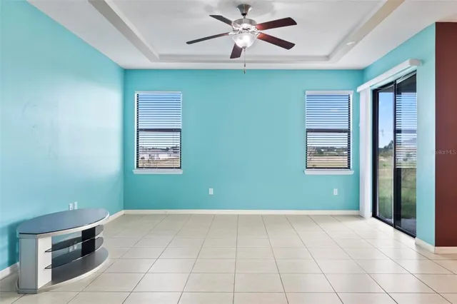 a kitchen with granite countertop a stove top oven microwave and cabinets