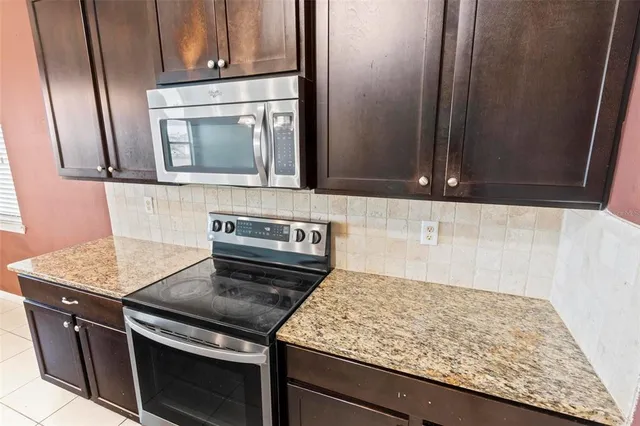a view of a room with wooden floor and a chair