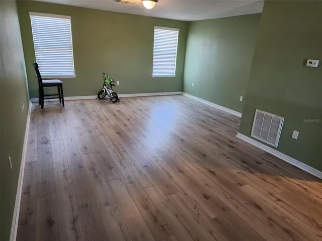 a view of an empty room with a window