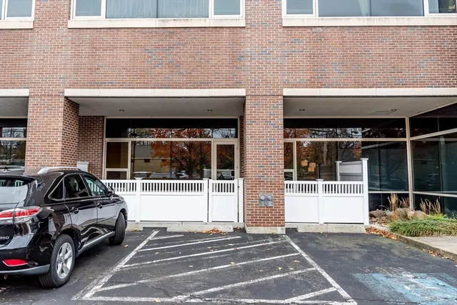 a view of a car park in front of a building