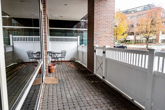 a view of a balcony with wooden floor