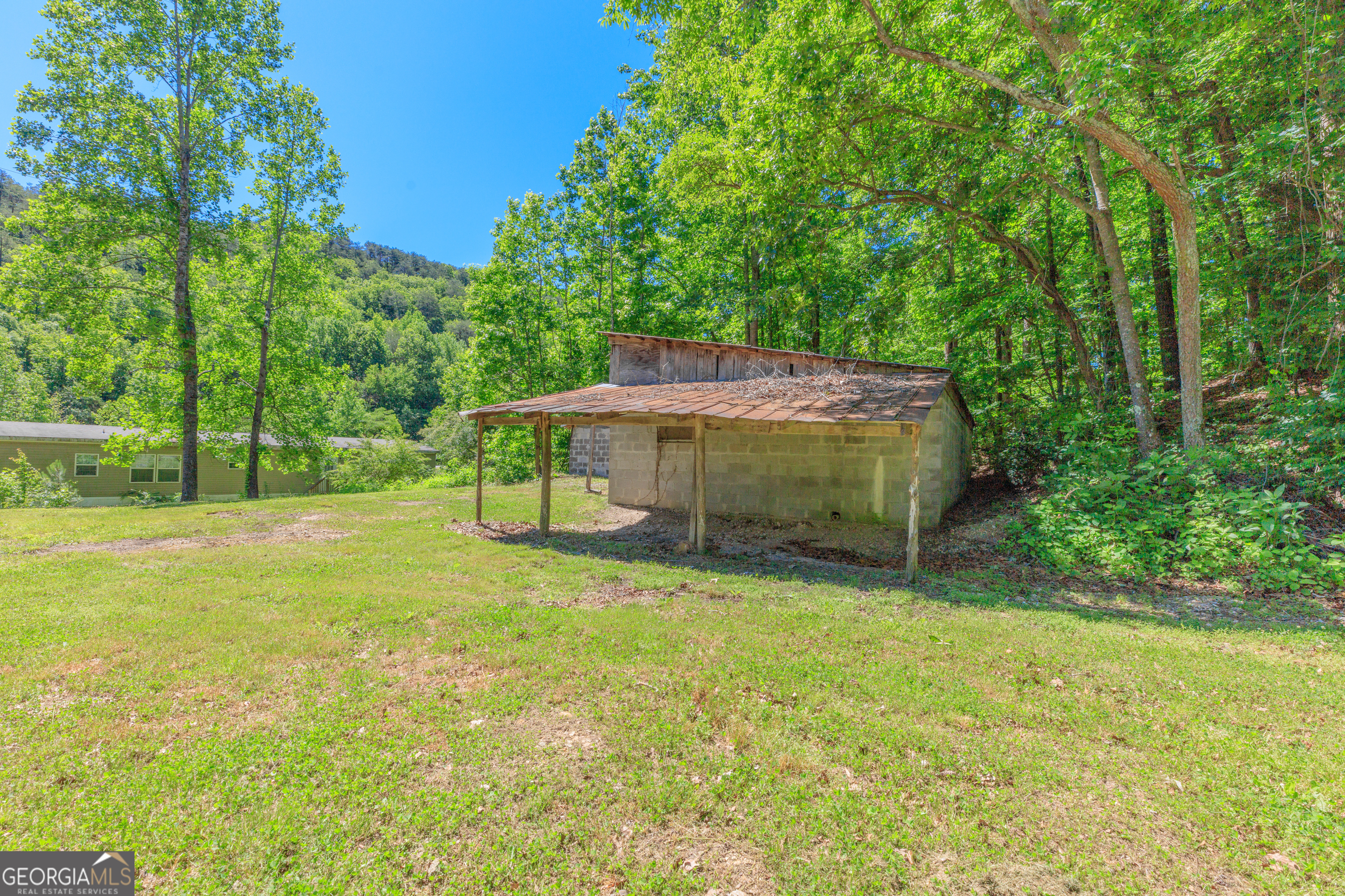 1004 Crow Gap Road Chickamauga, GA 30707 - Photo 30 of 36 a view of a house with a yard