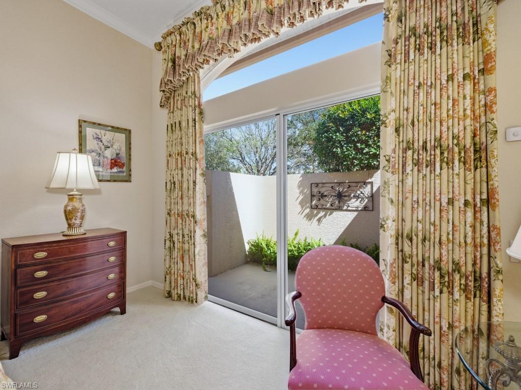 5835 Persimmon Way Naples, FL 34110 - Photo 11 of 50 a bedroom with a bed and a window