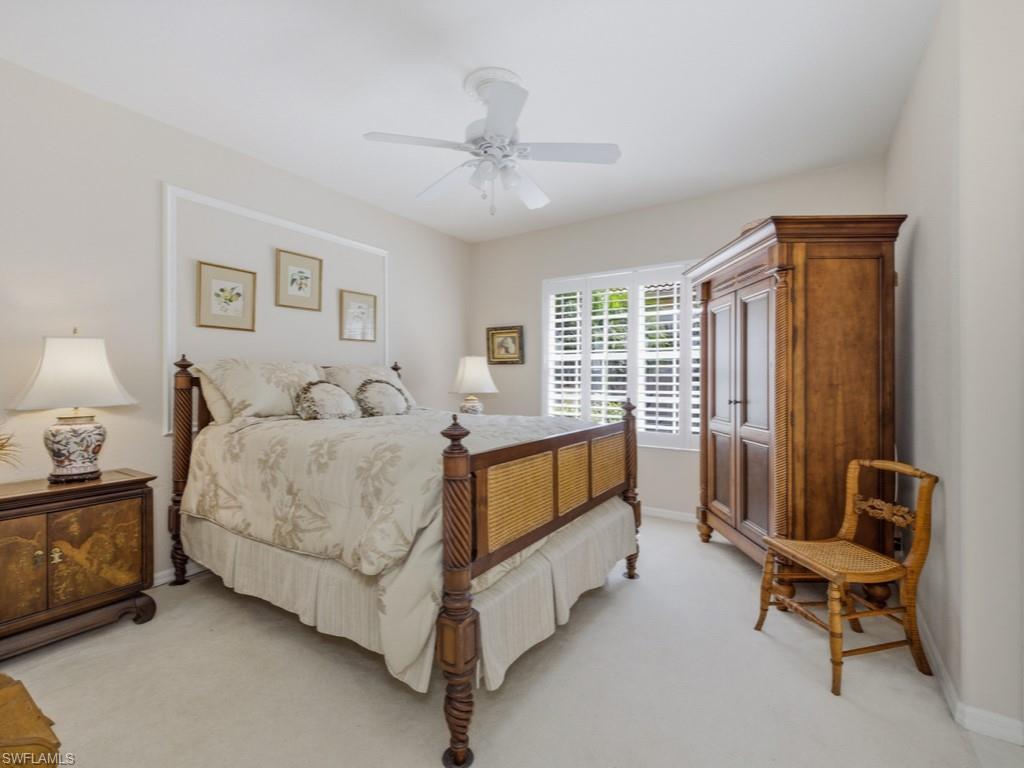 5835 Persimmon Way Naples, FL 34110 - Photo 14 of 50 a spacious bedroom with a bed and a window