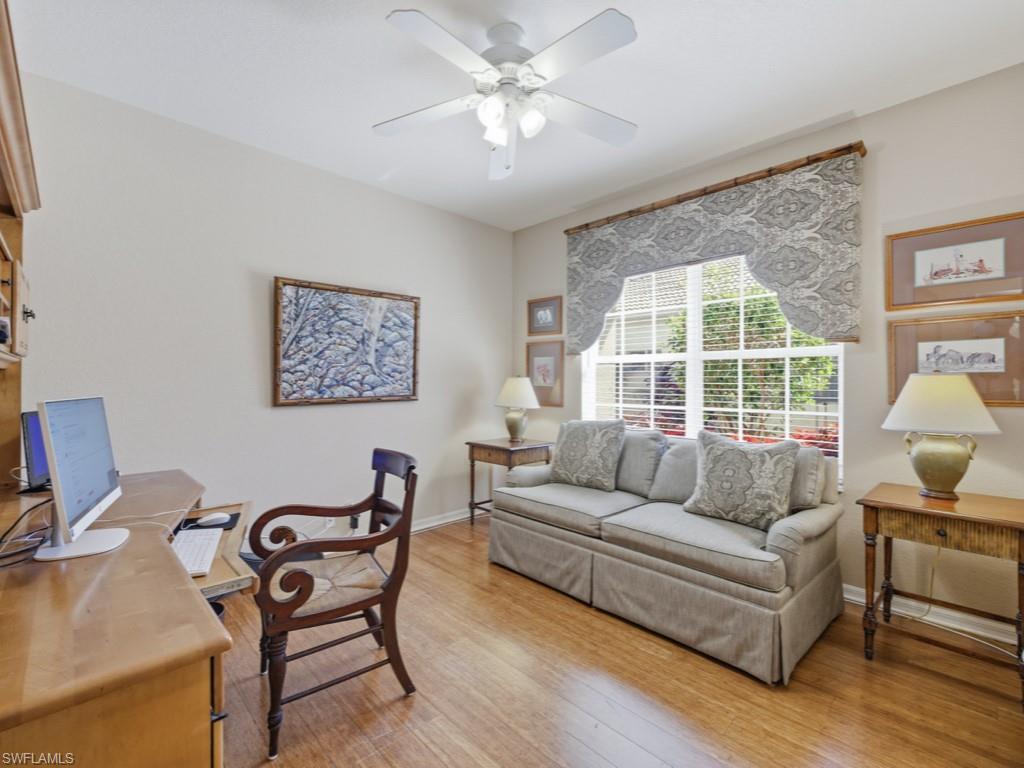 5835 Persimmon Way Naples, FL 34110 - Photo 16 of 50 a living room with furniture and a large window