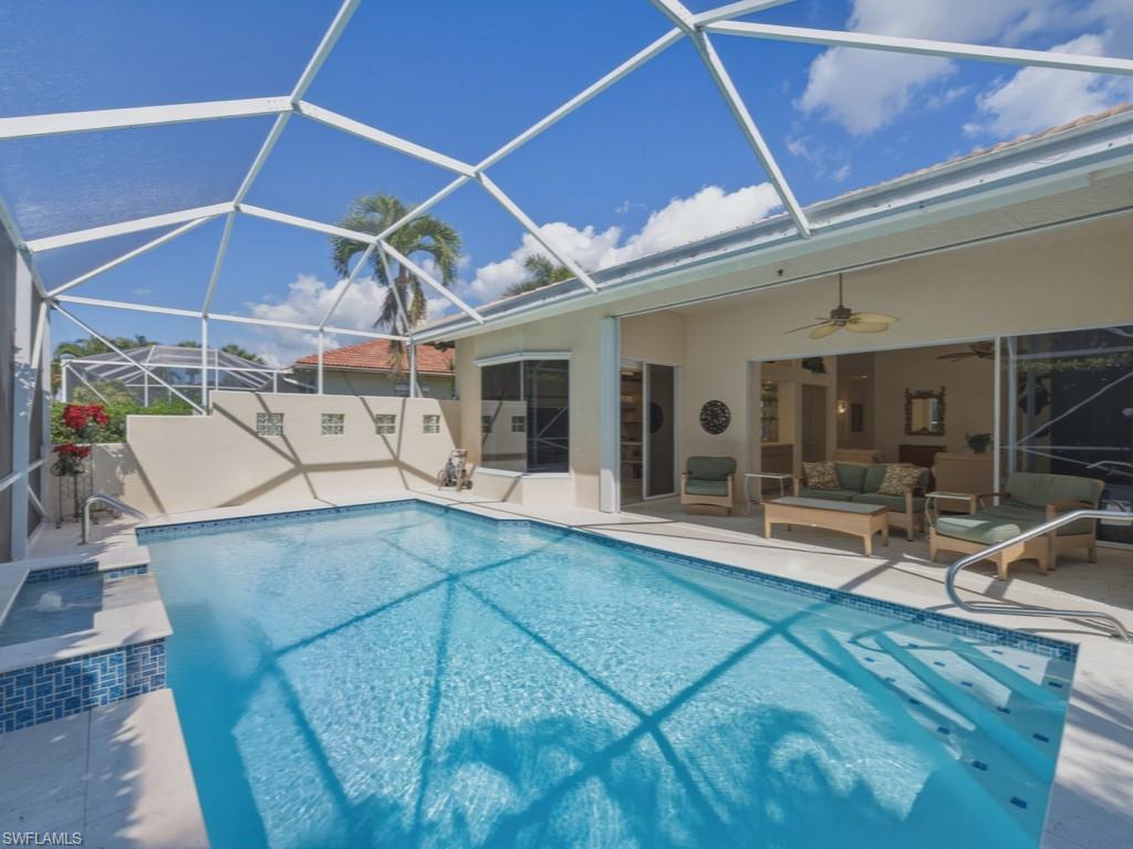 5835 Persimmon Way Naples, FL 34110 - Photo 21 of 50 a view of a patio with table and chairs