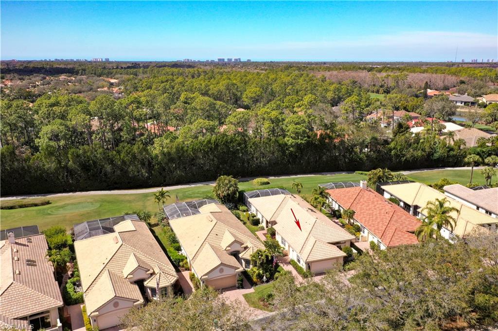 5835 Persimmon Way Naples, FL 34110 - Photo 23 of 50 an aerial view of residential houses with outdoor space