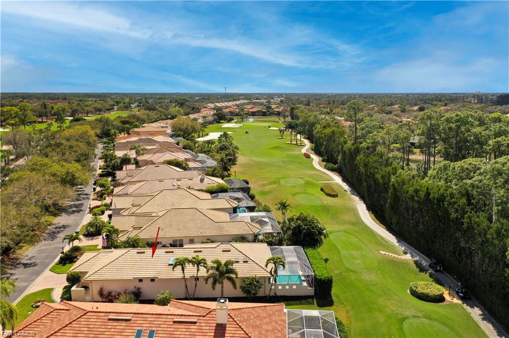 5835 Persimmon Way Naples, FL 34110 - Photo 26 of 50 an aerial view of residential houses with outdoor space