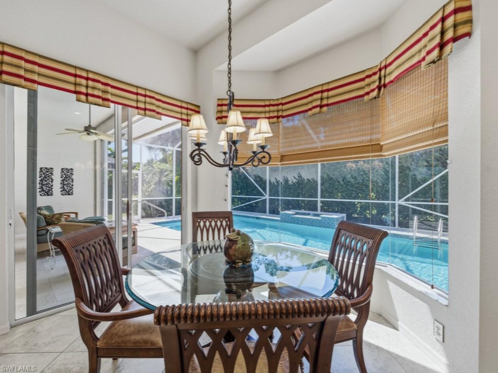 5835 Persimmon Way Naples, FL 34110 - Photo 3 of 50 a view of a dining room with furniture window and outside view