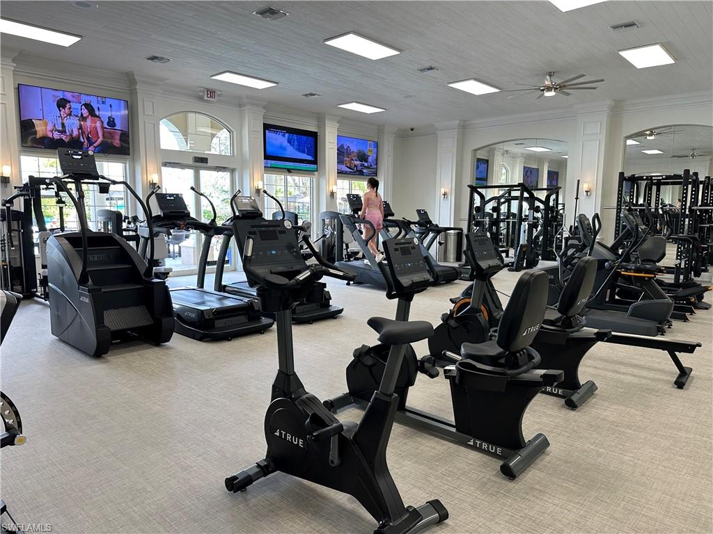 5835 Persimmon Way Naples, FL 34110 - Photo 49 of 50 a view of a room with gym equipment