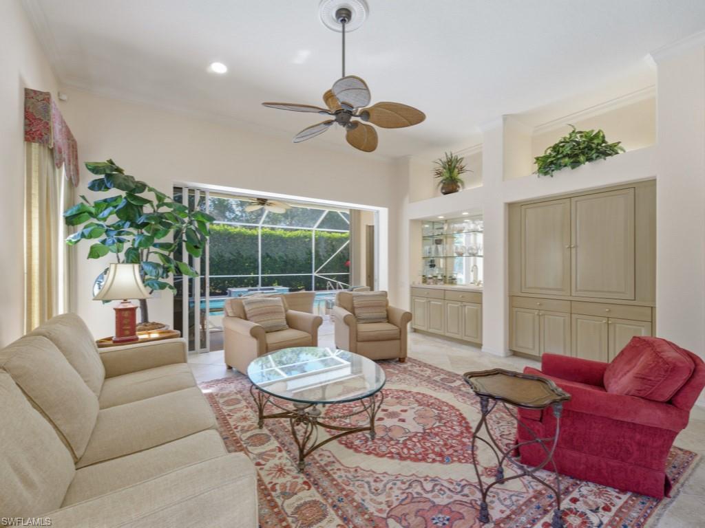 5835 Persimmon Way Naples, FL 34110 - Photo 5 of 50 a living room with furniture potted plant and a large window