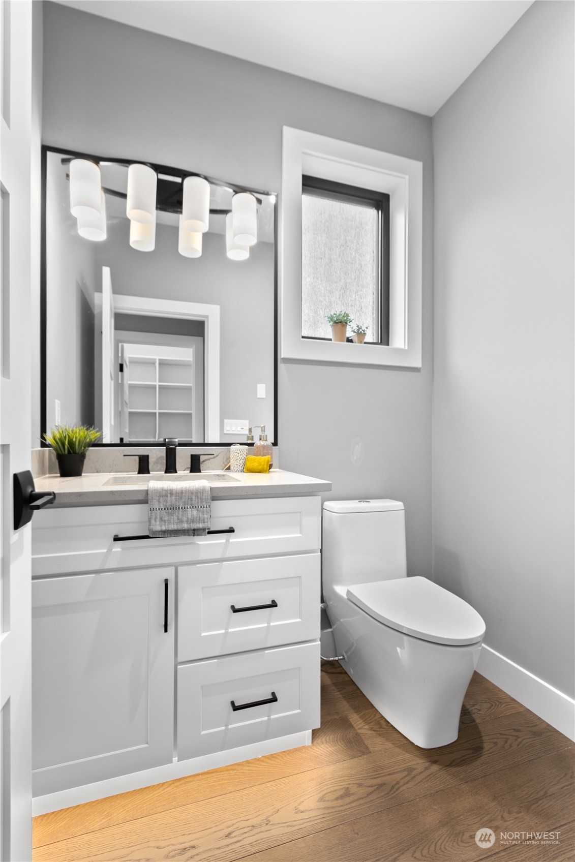3015 Maynard Place Bellingham, WA 98226 - Photo 11 of 38 a bathroom with a toilet a sink and mirror