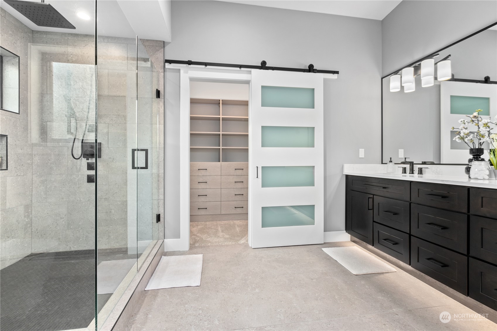 3015 Maynard Place Bellingham, WA 98226 - Photo 17 of 38 a bathroom with a double vanity sink a toilet and shower