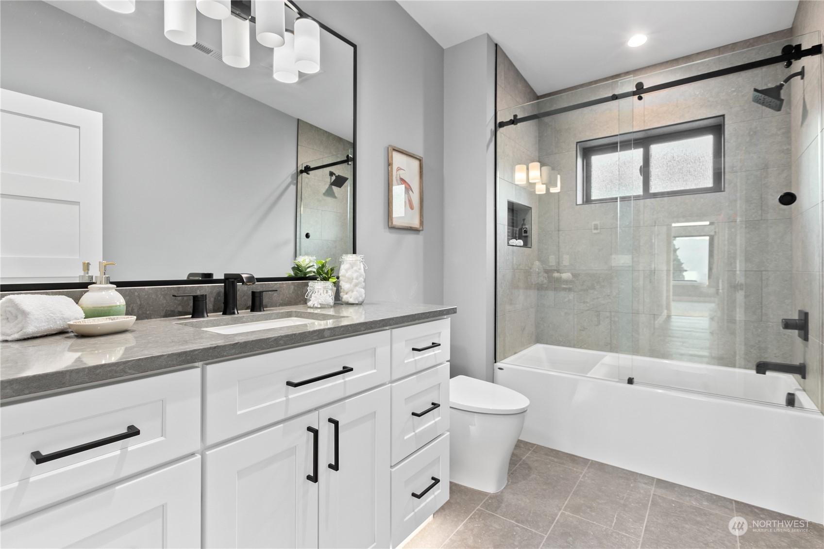 3015 Maynard Place Bellingham, WA 98226 - Photo 22 of 38 a spacious bathroom with a double vanity sink a toilet a shower and a mirror