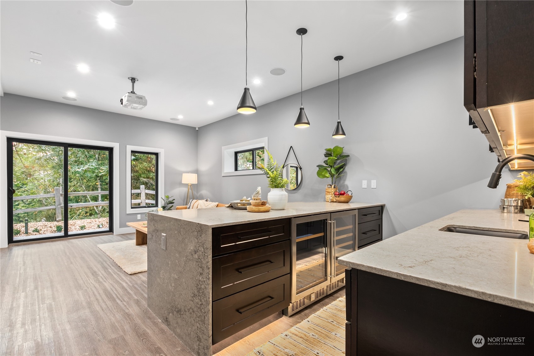 3015 Maynard Place Bellingham, WA 98226 - Photo 25 of 38 a kitchen with kitchen island a counter top space a sink appliances and a large window