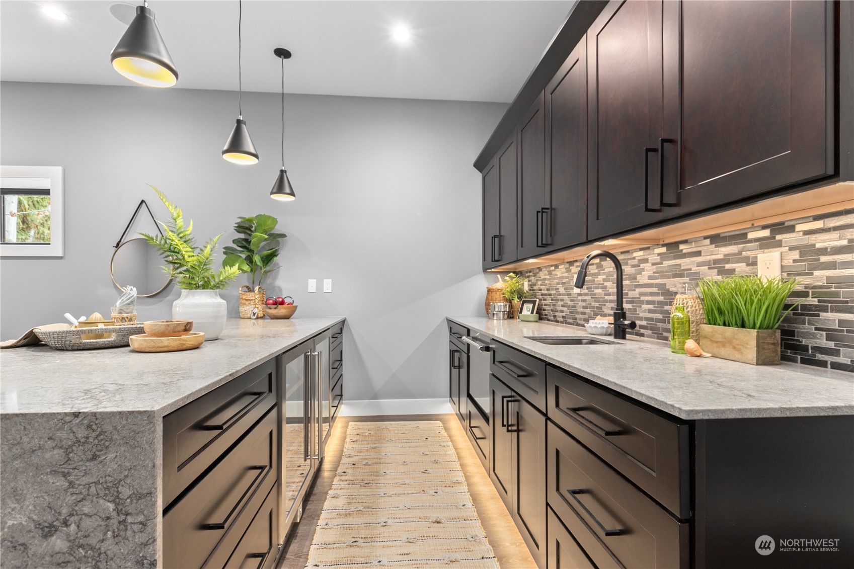 3015 Maynard Place Bellingham, WA 98226 - Photo 26 of 38 a kitchen with stainless steel appliances granite countertop a sink a stove and wooden cabinets