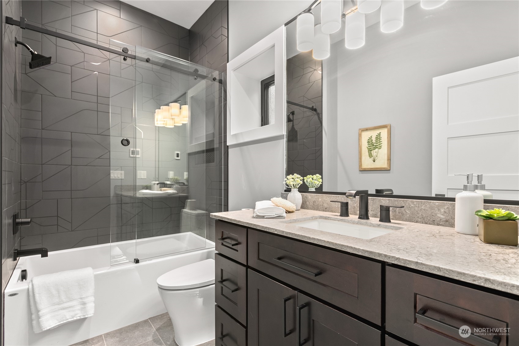 3015 Maynard Place Bellingham, WA 98226 - Photo 28 of 38 a bathroom with a granite countertop sink mirror vanity and toilet