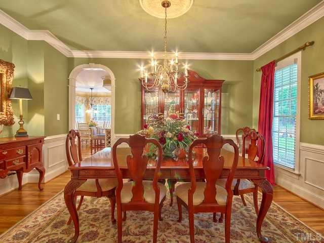 12509 Raven Ridge Road Raleigh, NC 27614 - Photo 5 of 25 a view of a dining room with furniture and chandelier