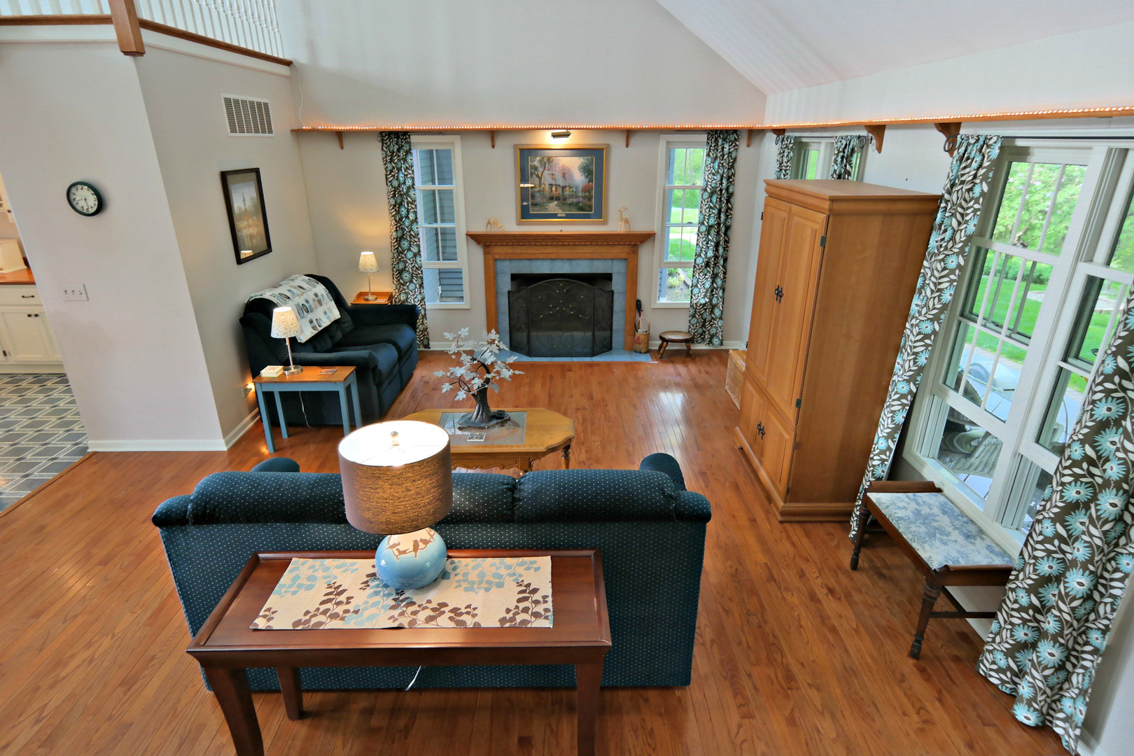 4115 Wilson Road Woodstock, IL 60098 - Photo 11 of 44 a living room with furniture and a fireplace