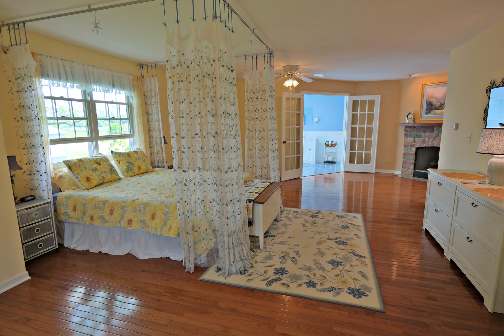 4115 Wilson Road Woodstock, IL 60098 - Photo 12 of 44 a spacious bedroom with a bed and wooden floor