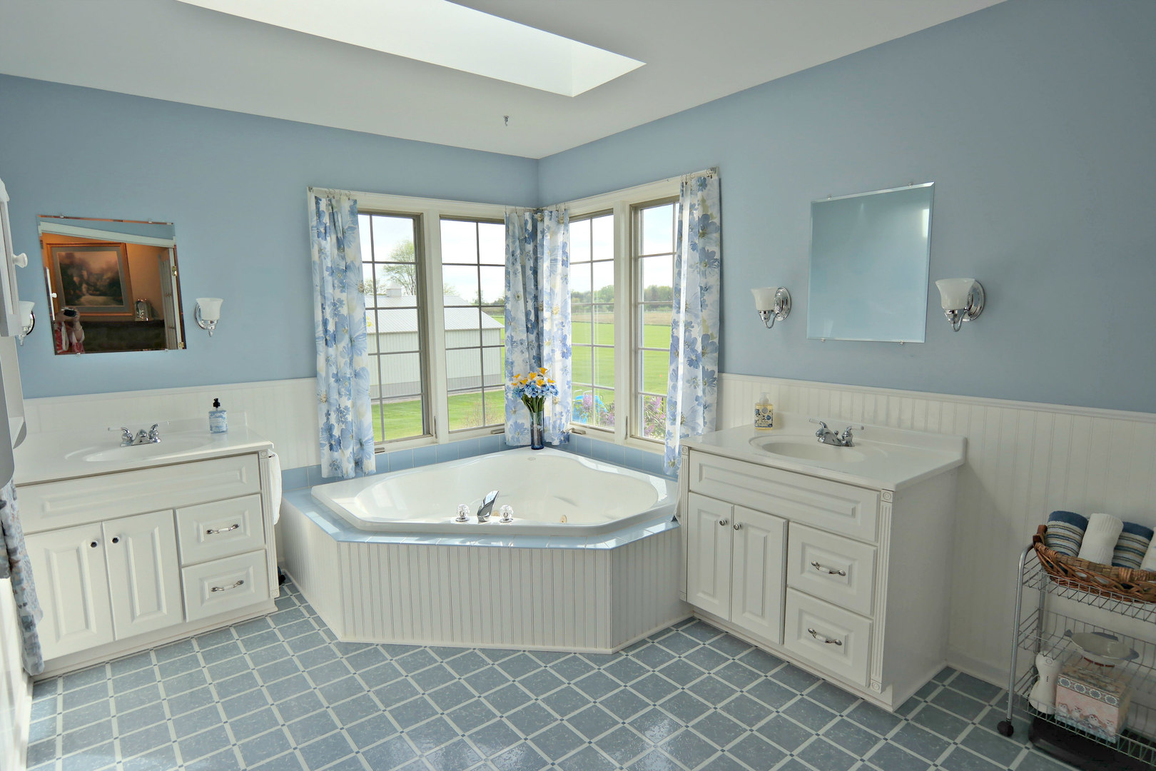 4115 Wilson Road Woodstock, IL 60098 - Photo 15 of 44 a spacious bathroom with a tub sink and mirror