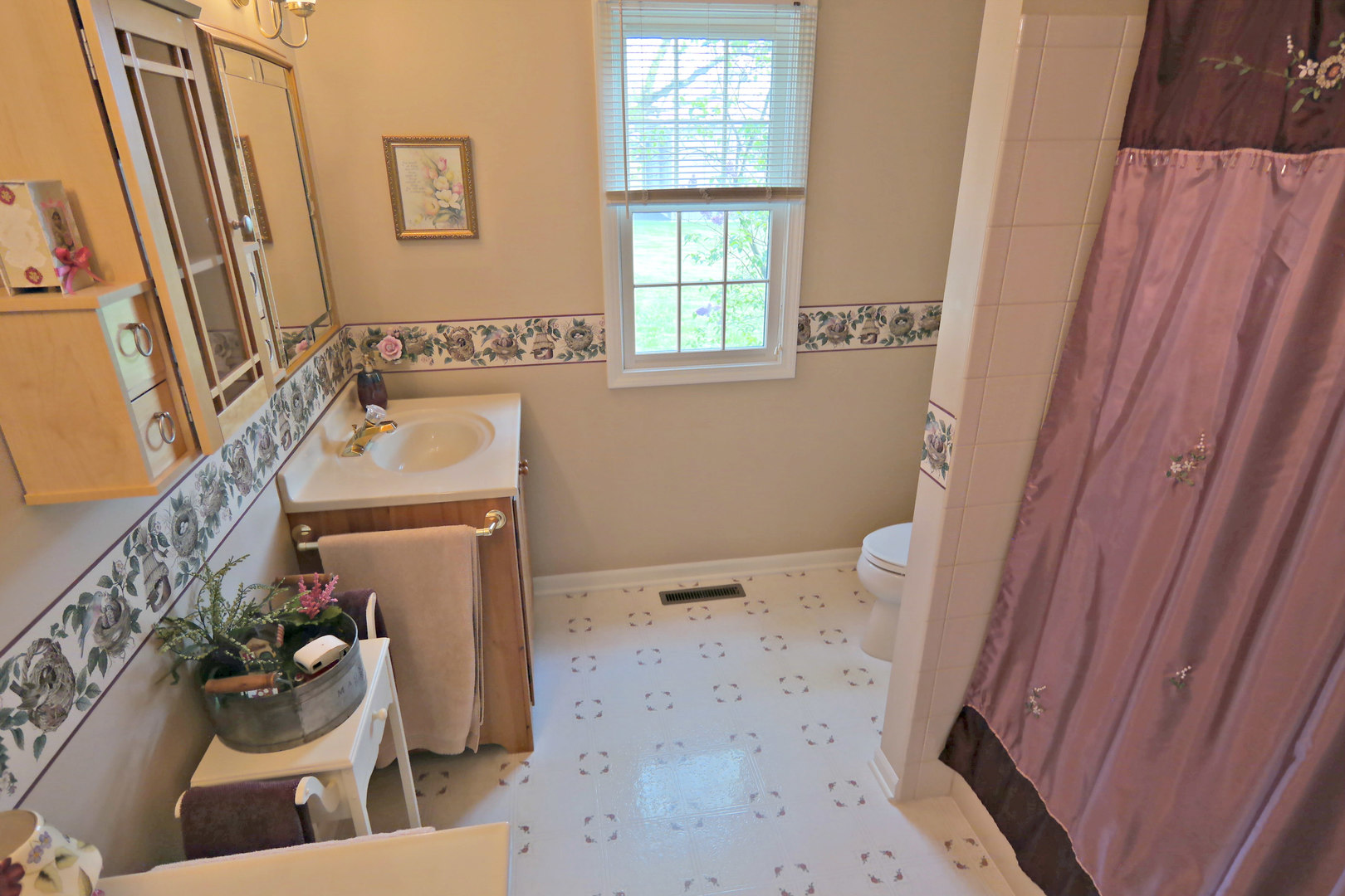 4115 Wilson Road Woodstock, IL 60098 - Photo 21 of 44 a bathroom with a sink toilet and shower