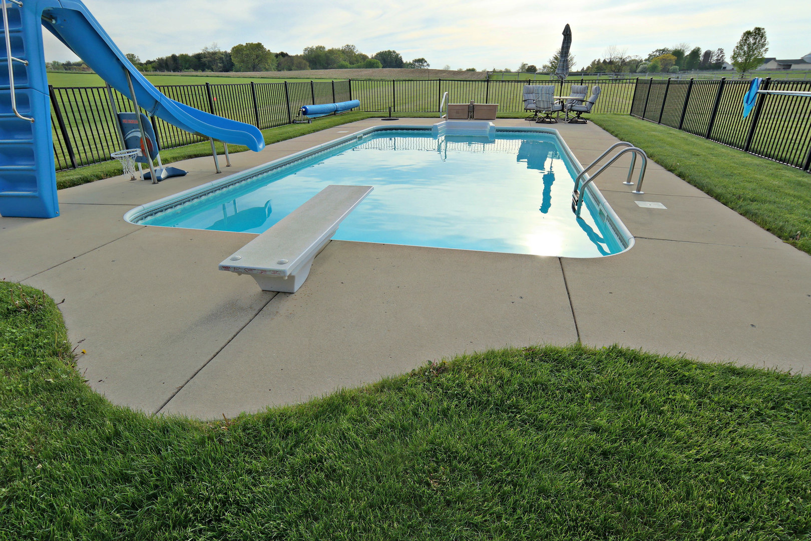 4115 Wilson Road Woodstock, IL 60098 - Photo 24 of 44 a view of a backyard with a small deck