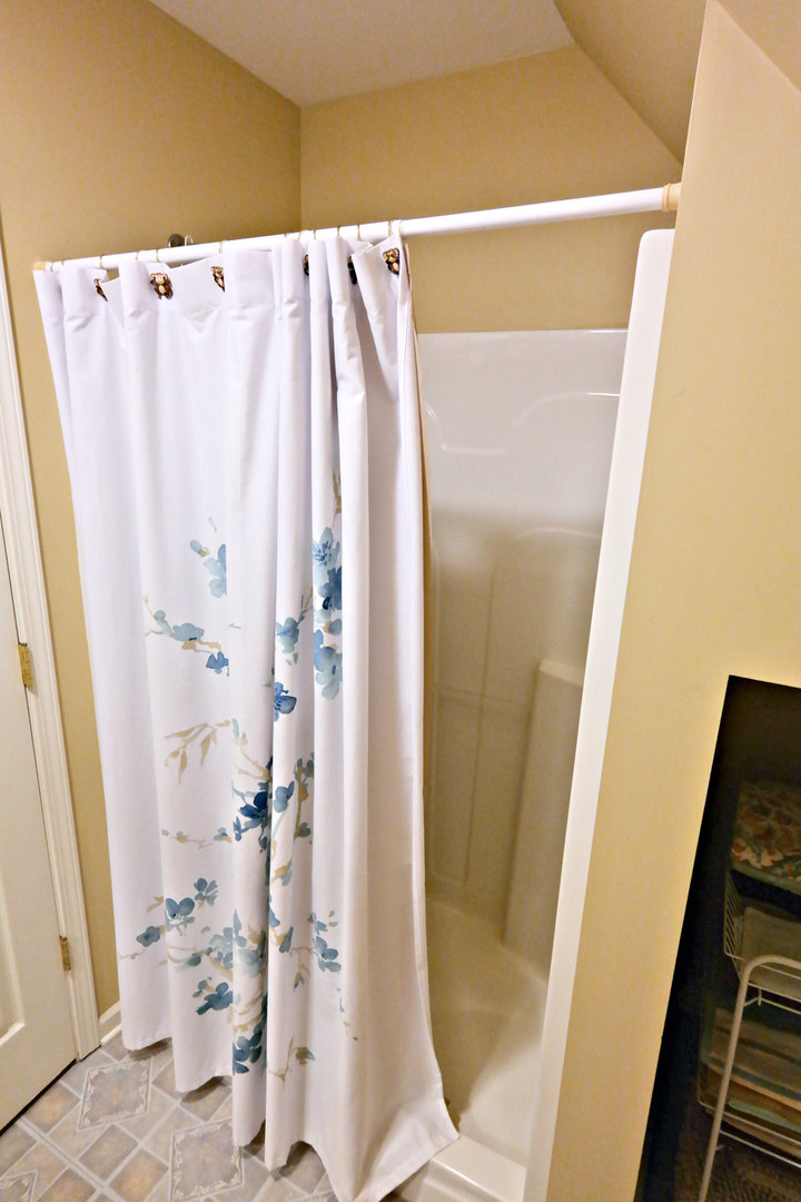 4115 Wilson Road Woodstock, IL 60098 - Photo 31 of 44 a bathroom with a shower and a mirror