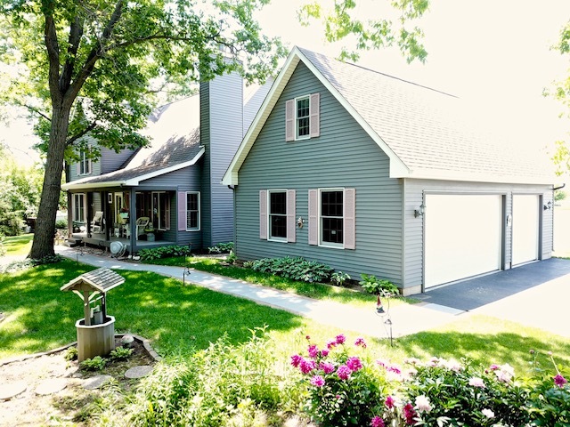 4115 Wilson Road Woodstock, IL 60098 - Photo 33 of 44 a view of a house with backyard and sitting area