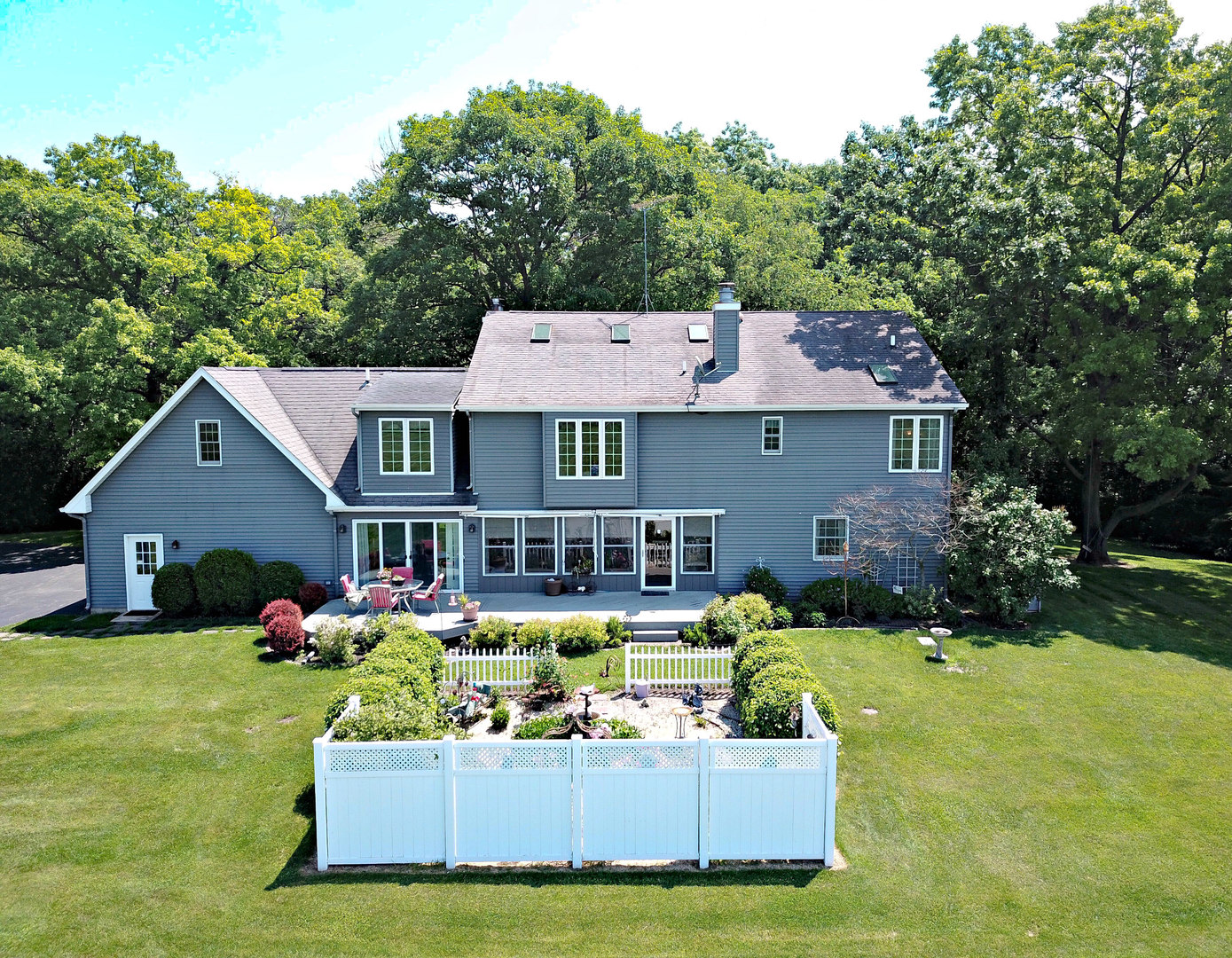4115 Wilson Road Woodstock, IL 60098 - Photo 39 of 44 a view of a house with pool and chairs