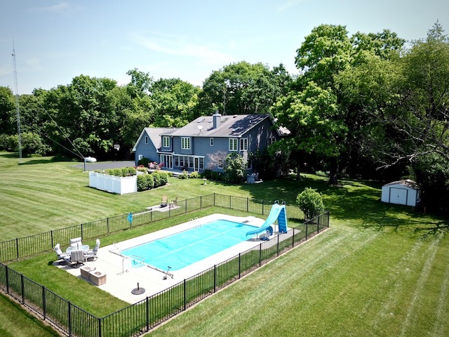 4115 Wilson Road Woodstock, IL 60098 - Photo 5 of 44 a view of a house with pool and chairs
