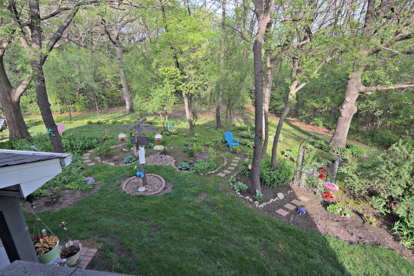 4115 Wilson Road Woodstock, IL 60098 - Photo 6 of 44 a backyard of a house with lots of green space and garden
