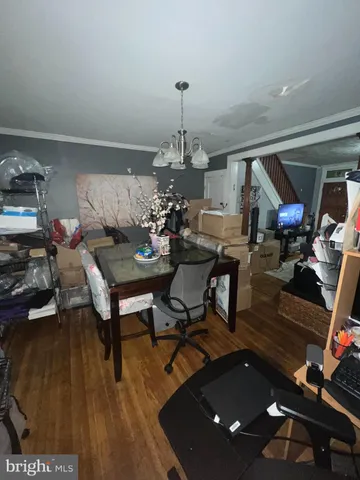 a living room with furniture a rug and a chandelier