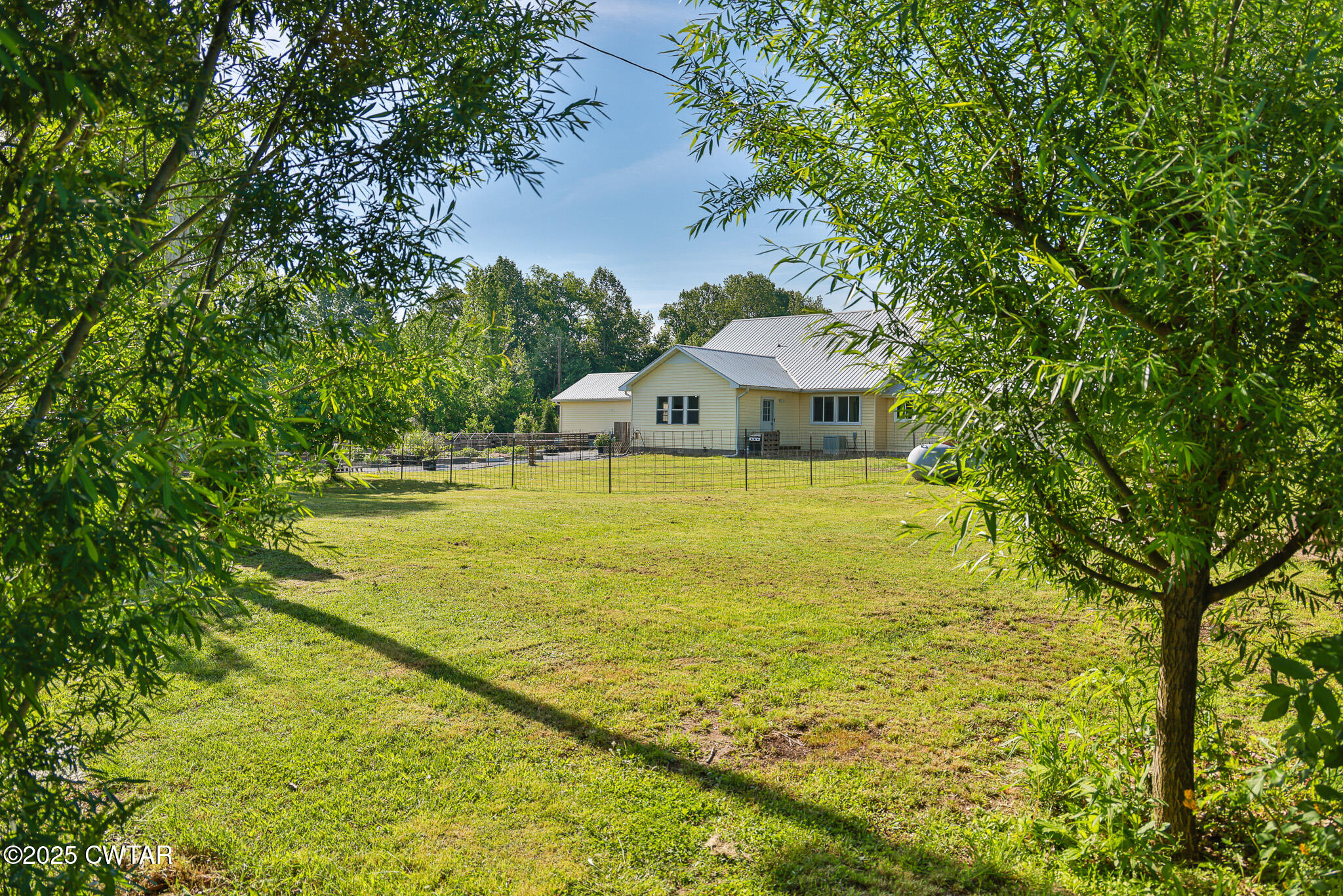 1461 Bynum Road Dresden, TN 38225 - Photo 11 of 60 a view of a swimming pool with an outdoor seating and a yard