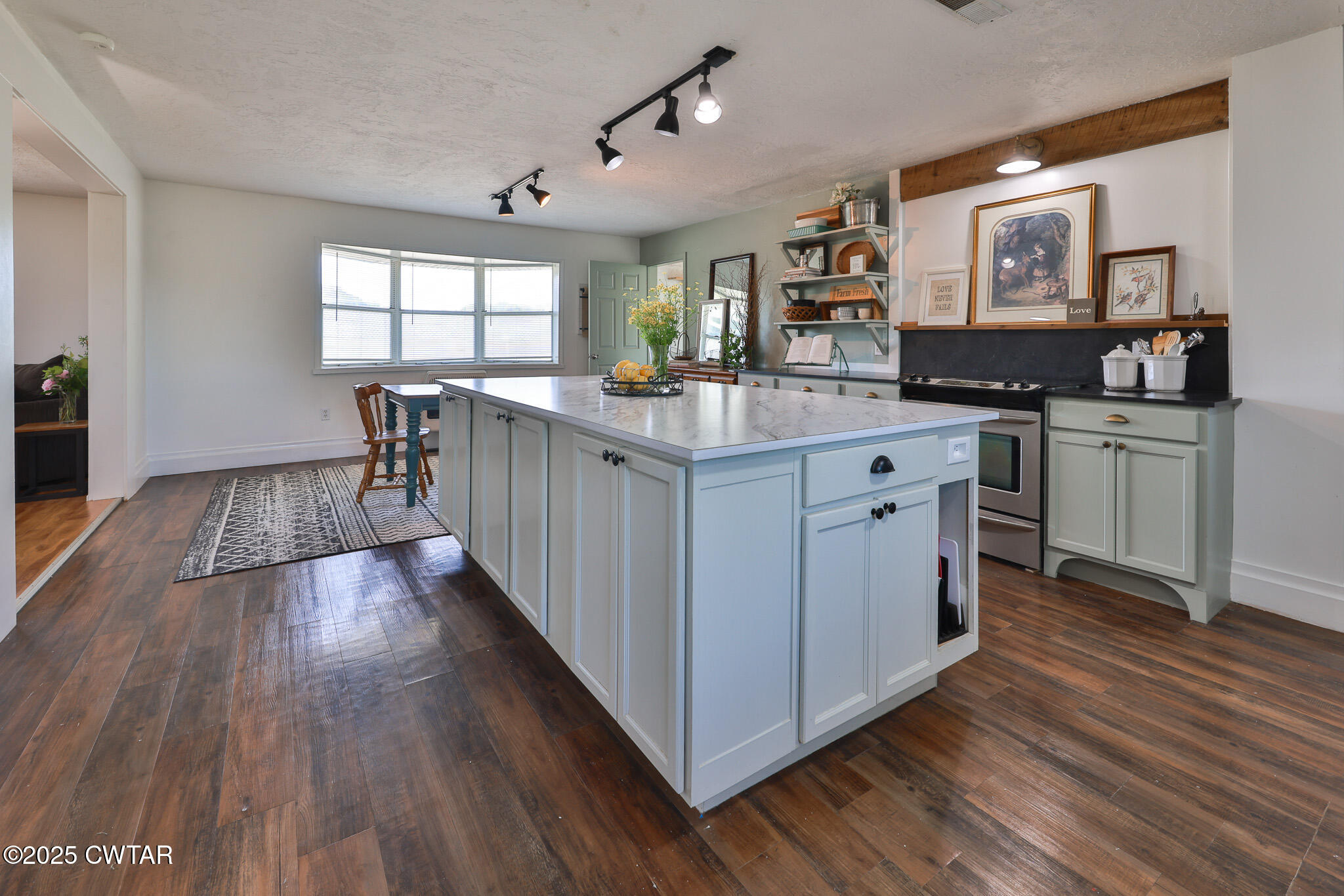 1461 Bynum Road Dresden, TN 38225 - Photo 23 of 60 a kitchen with granite countertop a stove and wooden floor
