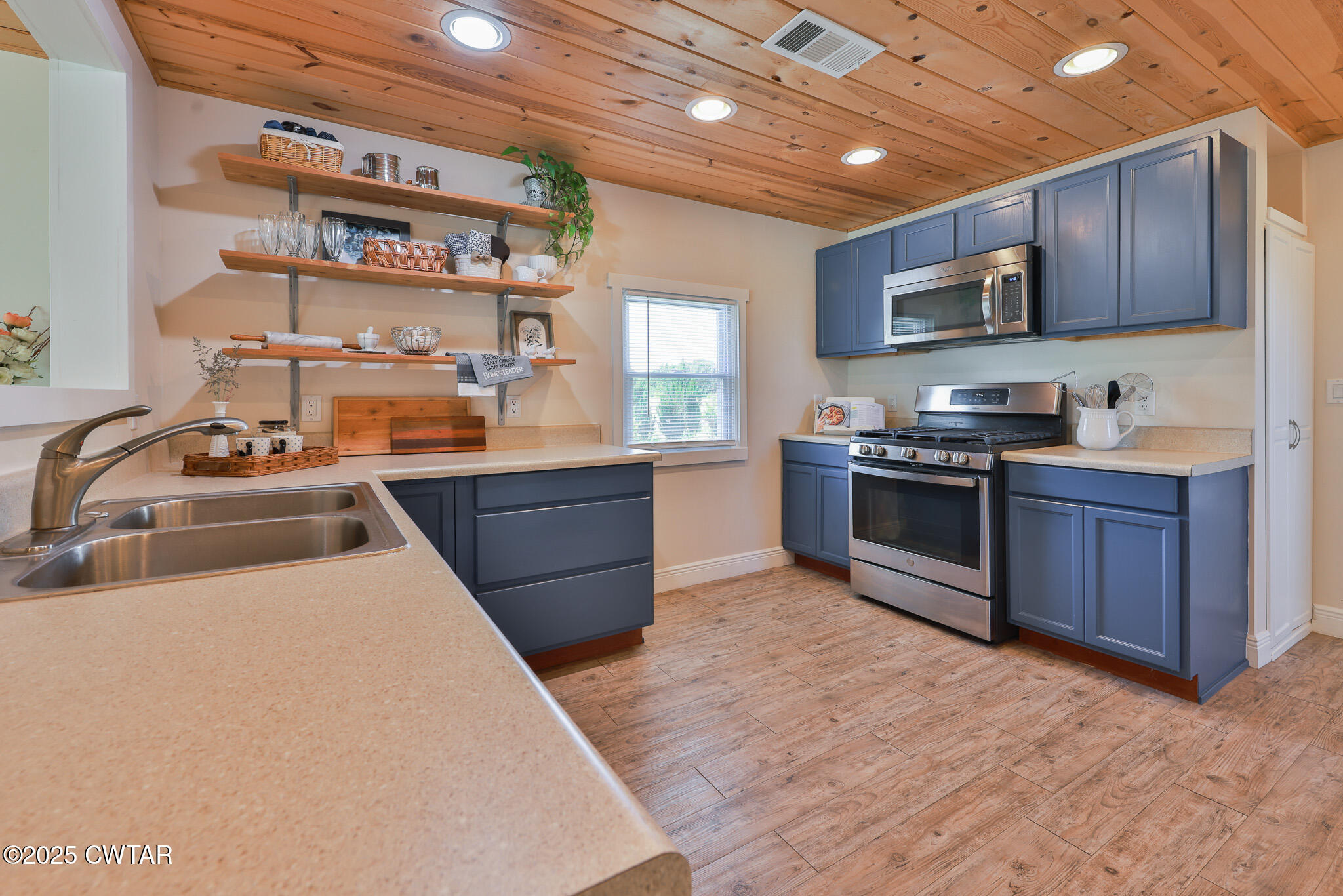 1461 Bynum Road Dresden, TN 38225 - Photo 50 of 60 a kitchen with stainless steel appliances granite countertop a stove sink and cabinets