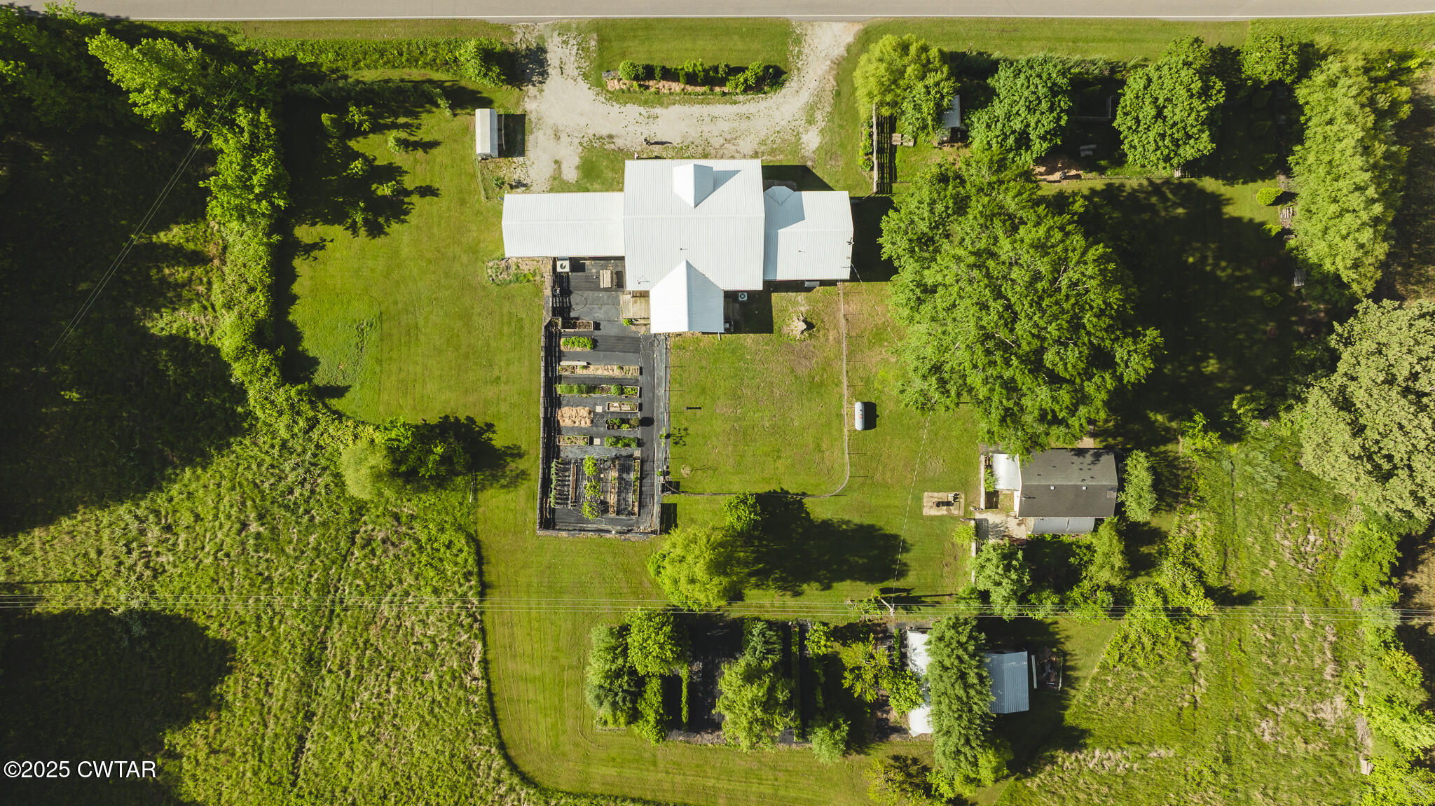 1461 Bynum Road Dresden, TN 38225 - Photo 7 of 60 an aerial view of residential houses with outdoor space and trees
